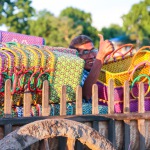 Head Weaver waving from cart loaded with Mowgs baskets