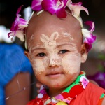 Burmese child with thanaka pattern on face